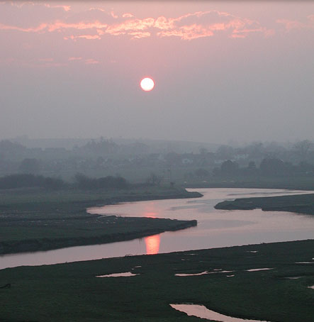 The Sun setting over the meandering River