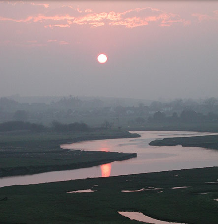 The Sun setting over the meandering River The Sun setting over the meandering River